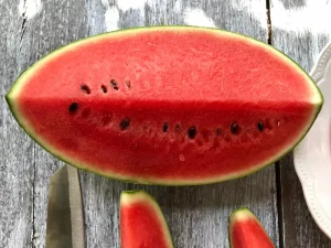 Fresh red color of organic watermelon slice on the old wooden blackground - Health Benefits of Watermelon