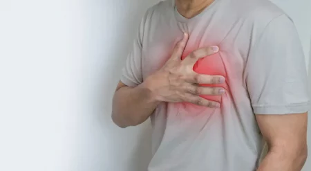 Hands holding chest with symptom heart attack disease - Heart Palpitations