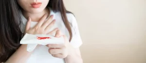 Woman have a coughing up blood and chest pain - symptoms of leukemia