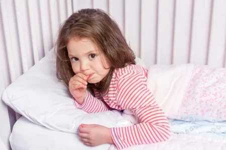 cute little girl resisting to sleep in her bed - 3-Year-Old Sleep Regression